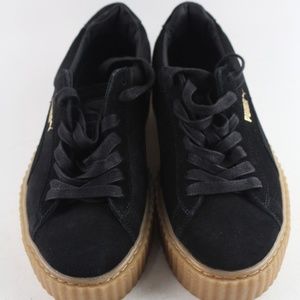 Black platform Puma sneakers